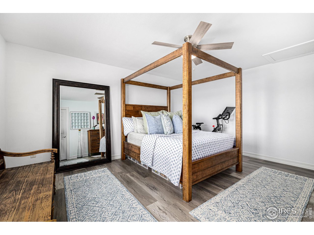 6588 Aberdour Circle Windsor, CO 80550 - Photo 26 of 40 a bedroom with a bed and a window