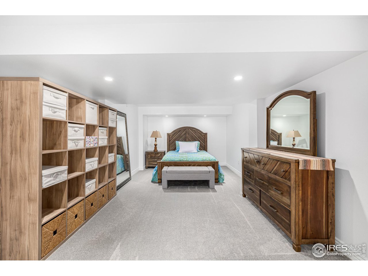 6588 Aberdour Circle Windsor, CO 80550 - Photo 27 of 40 a bedroom with a bed and a cabinets