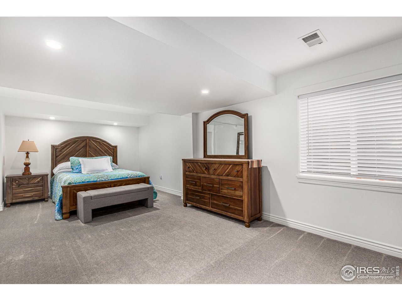 6588 Aberdour Circle Windsor, CO 80550 - Photo 28 of 40 a bedroom with a bed and a window