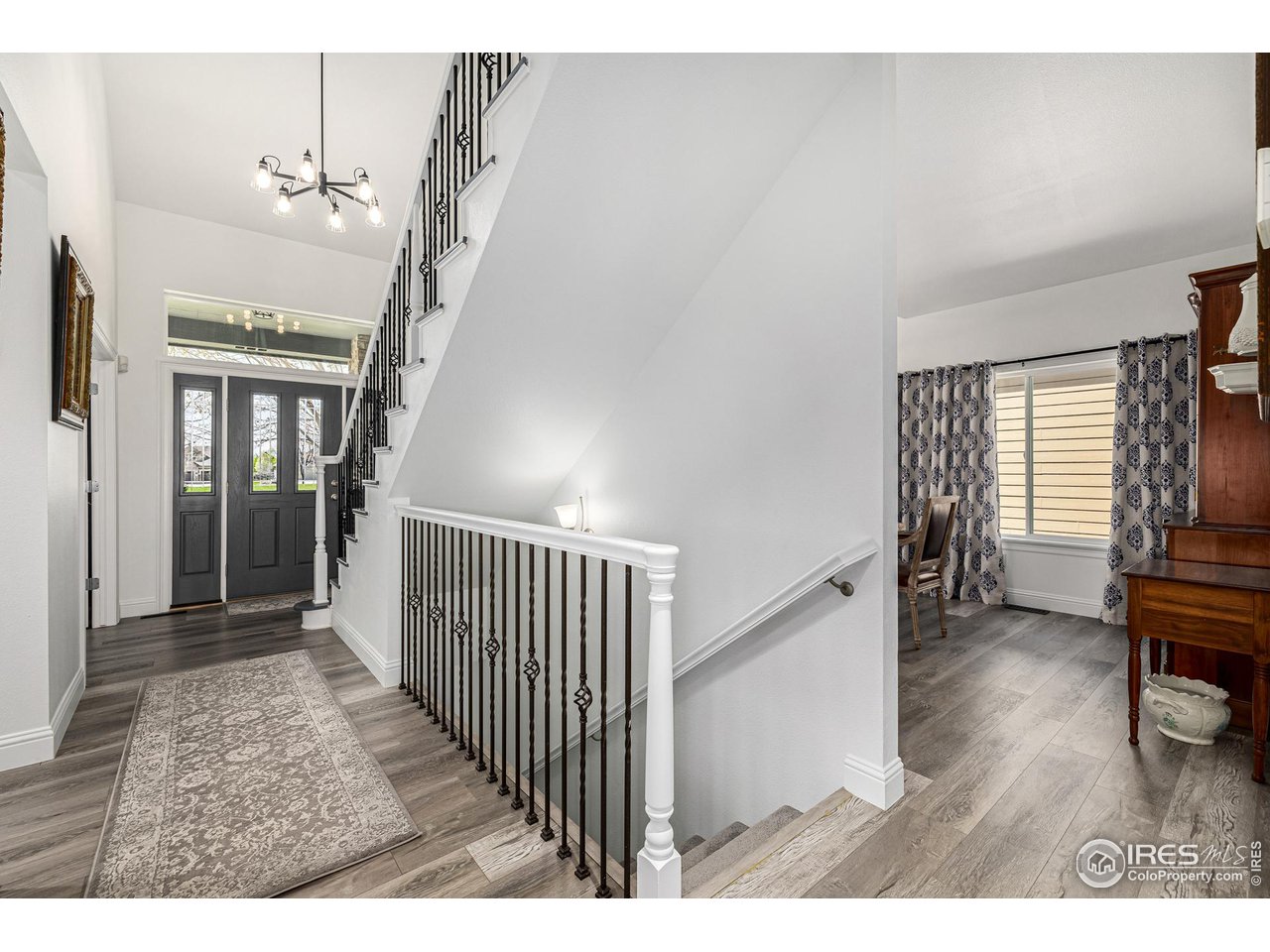 6588 Aberdour Circle Windsor, CO 80550 - Photo 3 of 40 a view interior of a house with wooden floor and furniture