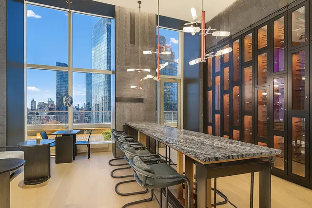 a view of a balcony dining table and chairs