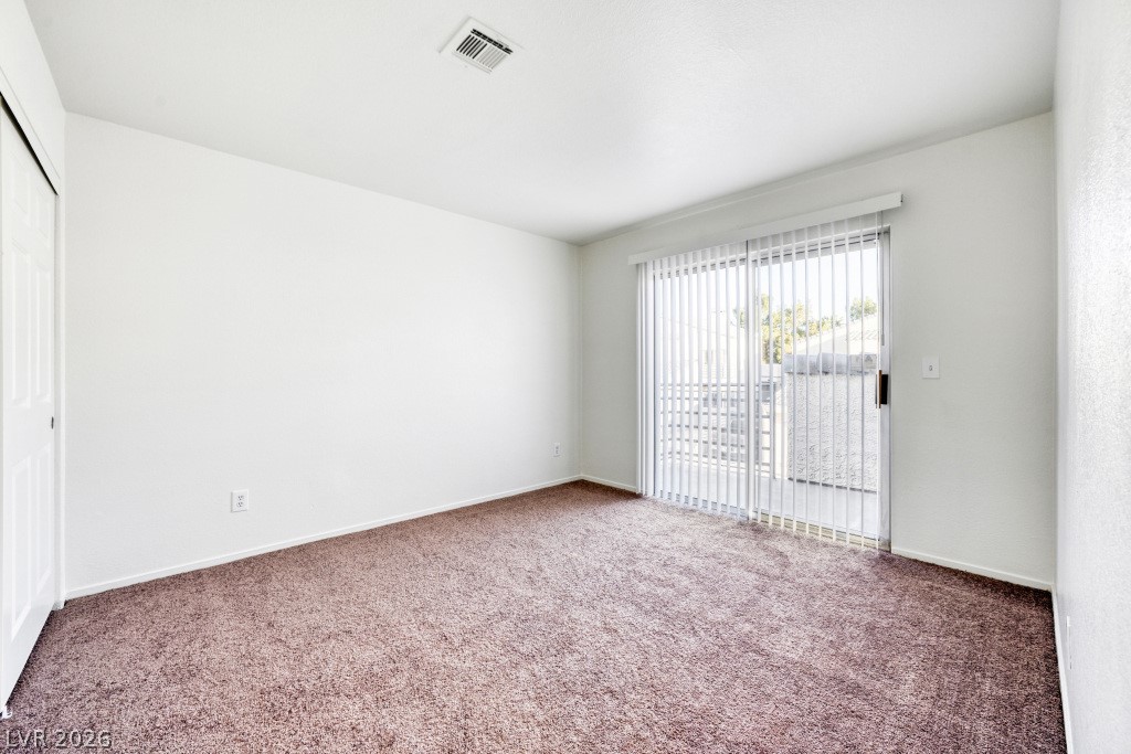 6250 West Flamingo Road, Unit 110 Las Vegas, NV 89103 - Photo 10 of 25 Secondary bedroom with balcony access