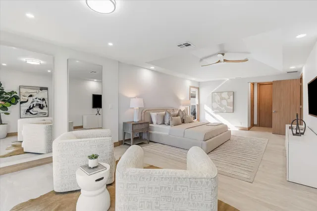 a spacious bathroom with a bathtub and sink