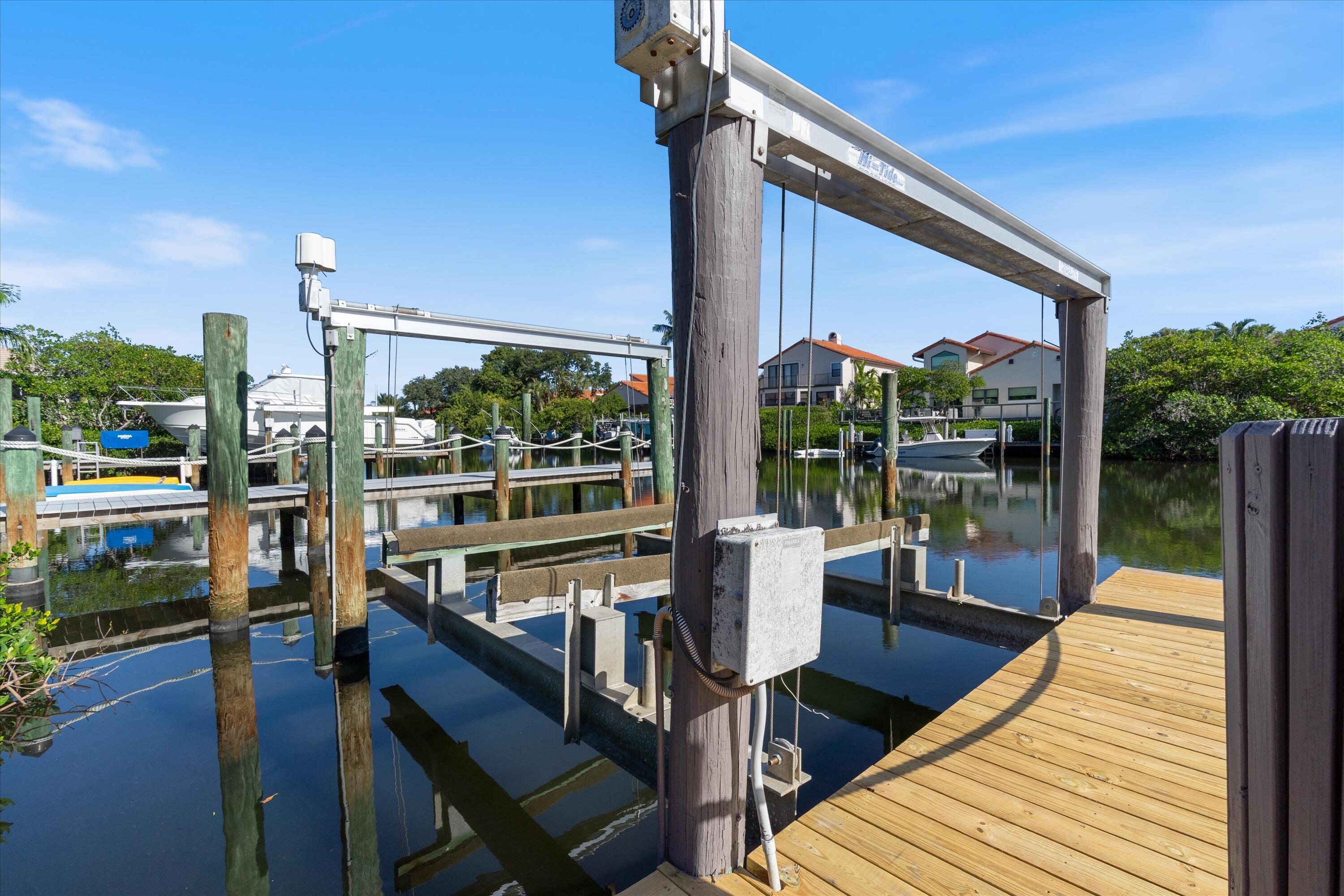 17036 Bay Street Jupiter, FL 33477 - Photo 51 of 68 a view of balcony with wooden floor and outdoor seating