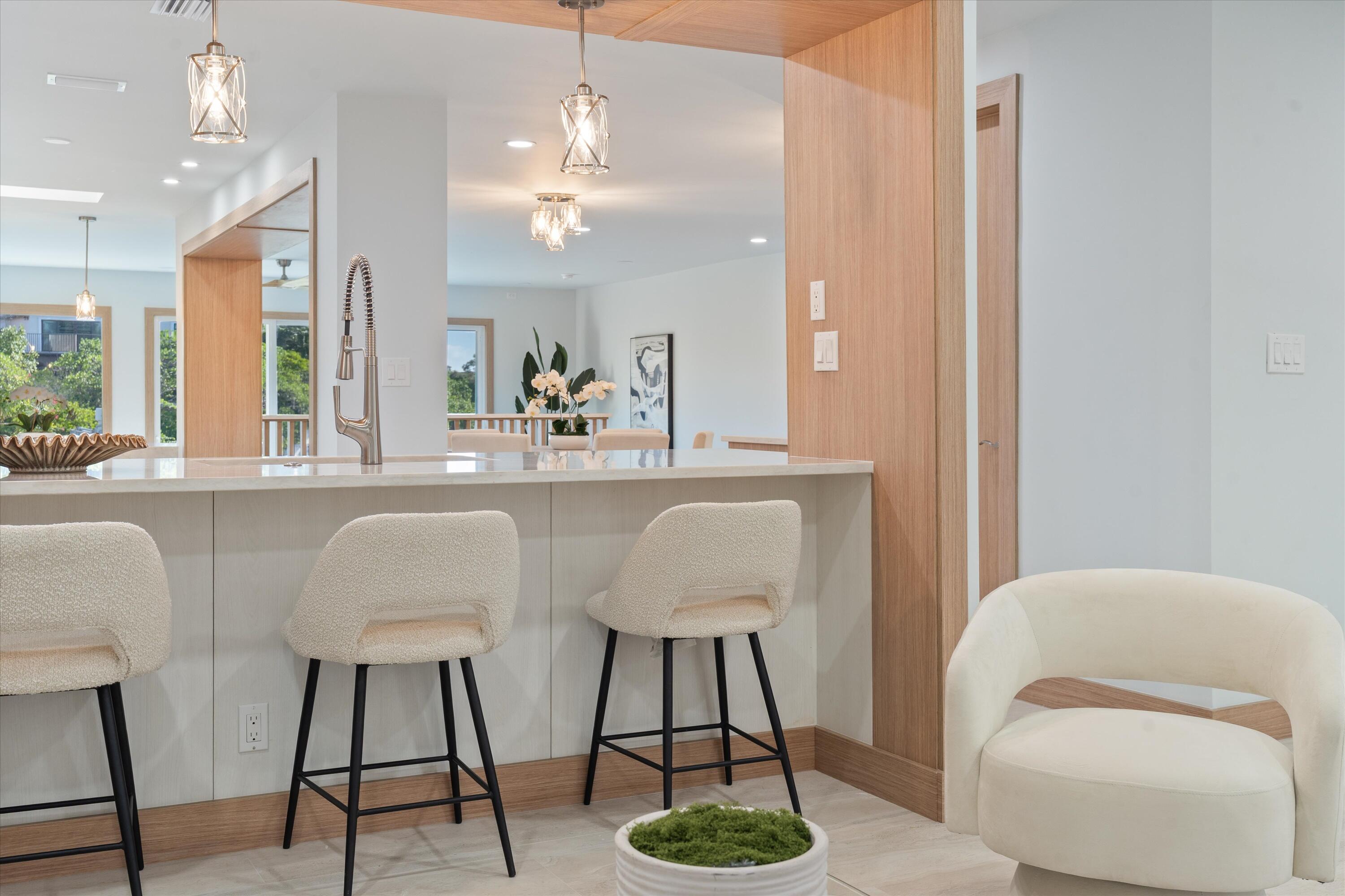 17036 Bay Street Jupiter, FL 33477 - Photo 10 of 68 a living room with furniture and a chandelier