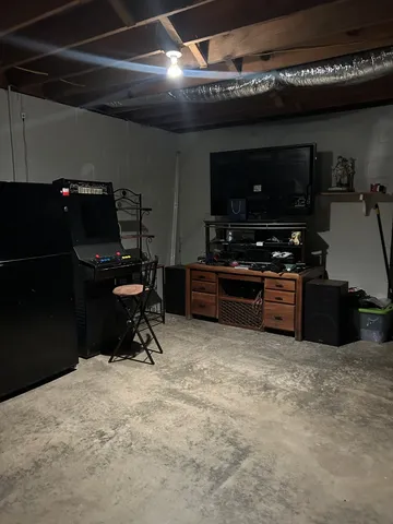 a view of a grassy field with trees in the background