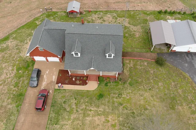 a view of house with yard
