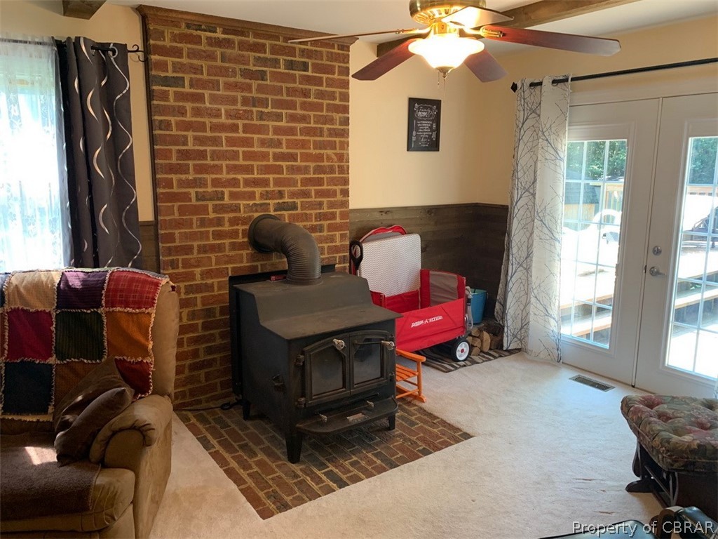 624 Butylo Road Laneview, VA 22504 - Photo 10 of 21 Beautiful brick work surround and wood stove add charm and warmth to the den.