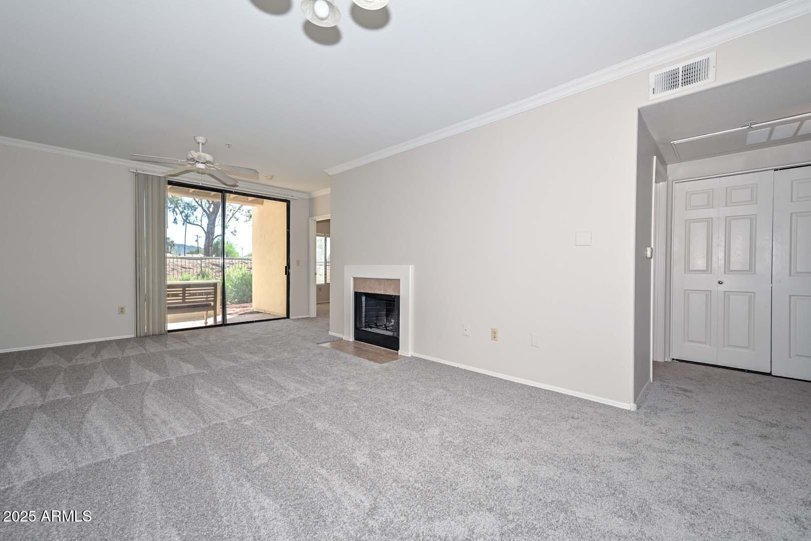 750 East Northern Avenue, Unit 1094 Phoenix, AZ 85020 - Photo 11 of 35 an empty room with windows and fireplace