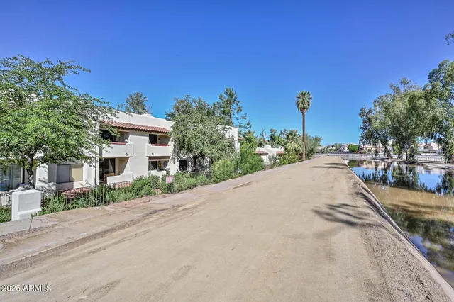 a view of a street with a building in the background