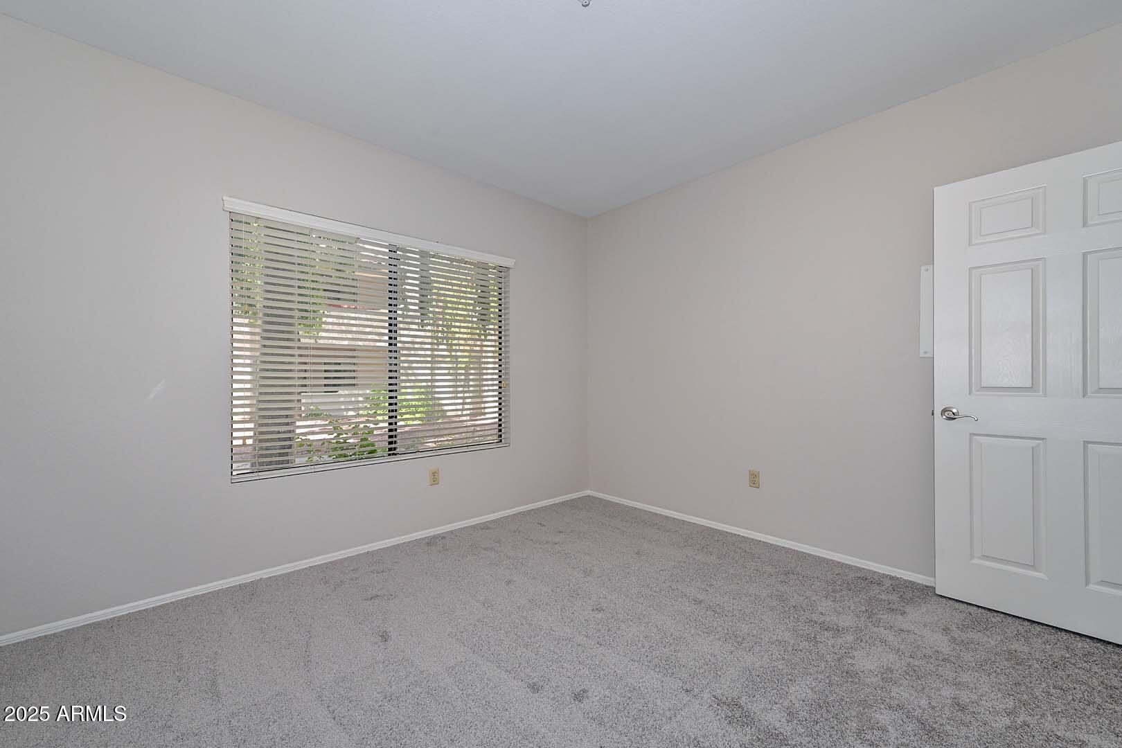 750 East Northern Avenue, Unit 1094 Phoenix, AZ 85020 - Photo 17 of 35 a view of an empty room with a window