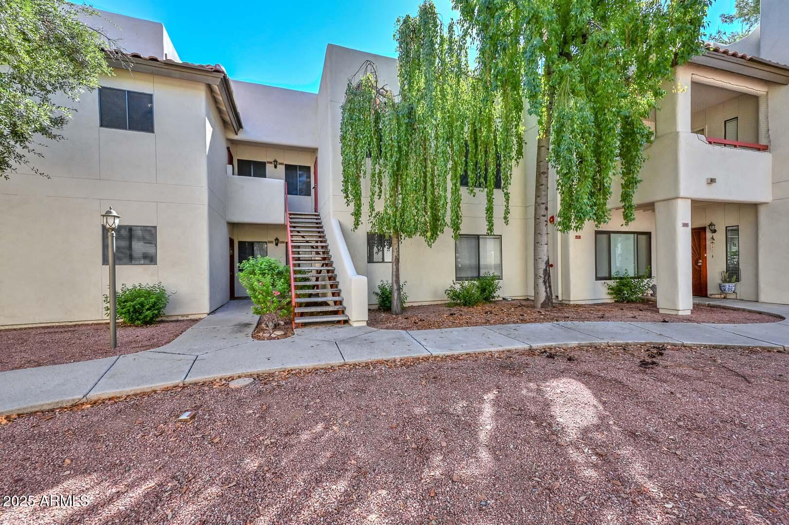 750 East Northern Avenue, Unit 1094 Phoenix, AZ 85020 - Photo 2 of 35 a view of a house with a street