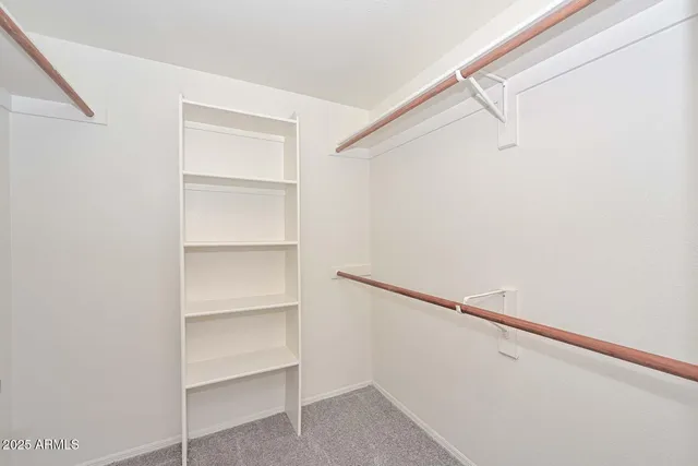 a view of an empty walk in closet