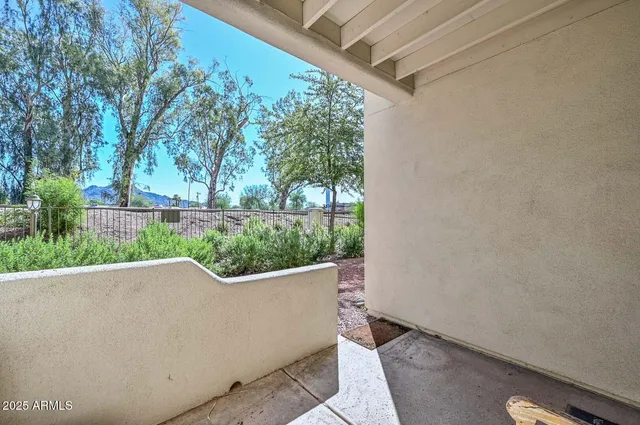 a bathroom with a granite countertop sink a toilet a shower and a mirror