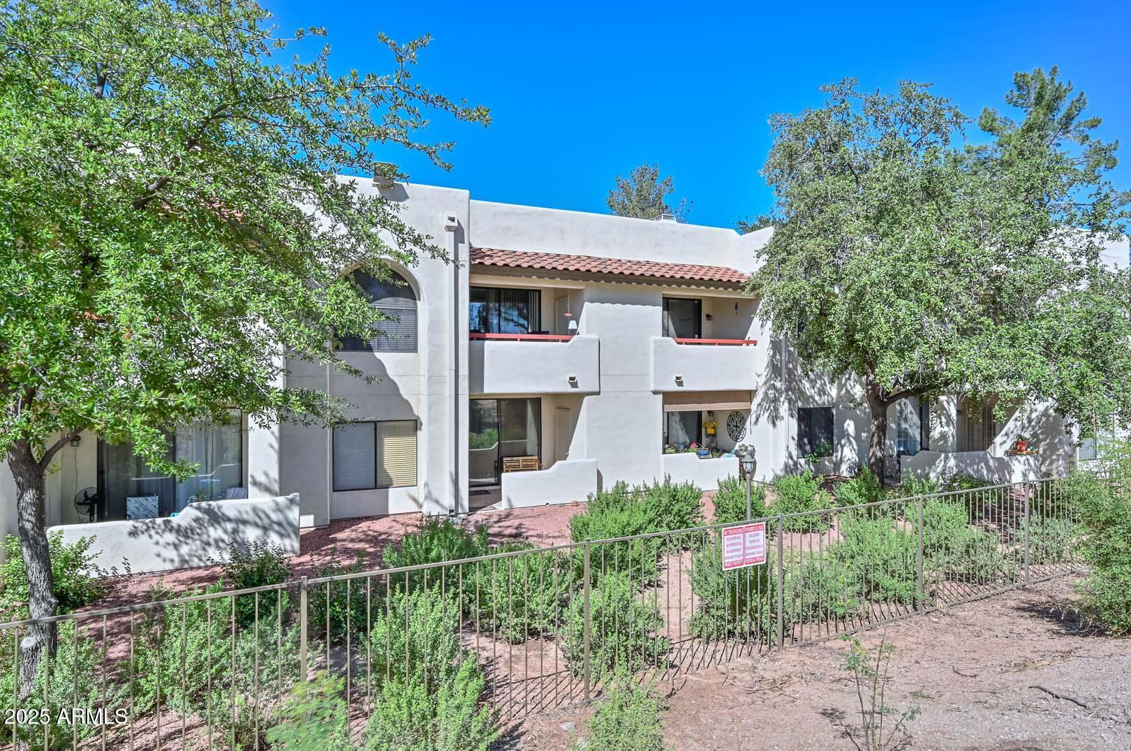 750 East Northern Avenue, Unit 1094 Phoenix, AZ 85020 - Photo 28 of 35 a front view of a house with a yard