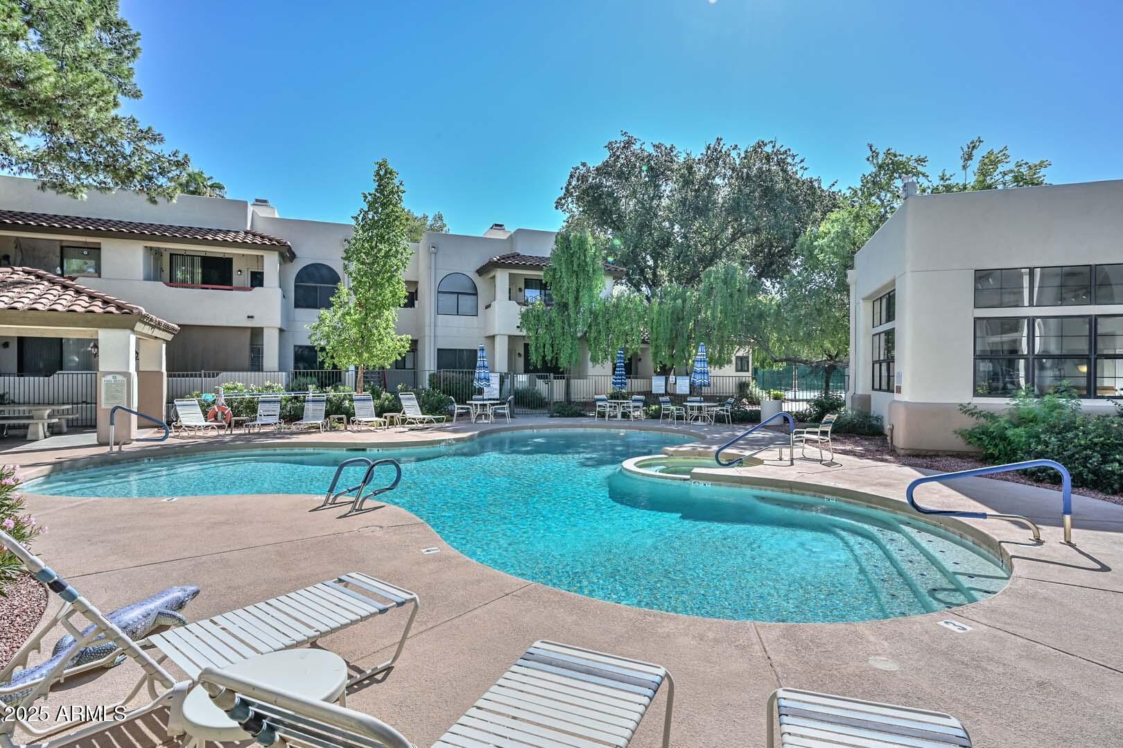 750 East Northern Avenue, Unit 1094 Phoenix, AZ 85020 - Photo 31 of 35 a view of a house with sitting area and fire pit