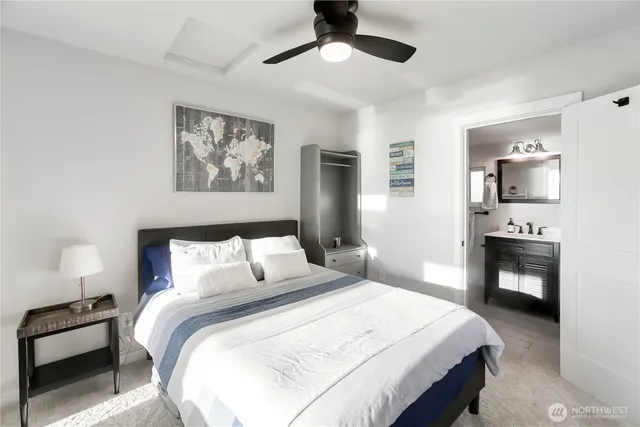 a bedroom with a bed and a tv