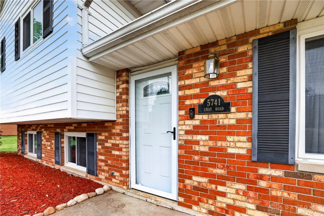 5741 Gray Road Fairfield, OH 45014 - Photo 3 of 32 This charming home features a classic brick and siding exterior with inviting curb appeal.