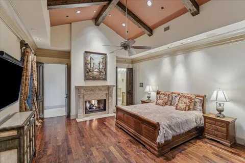 a bedroom with a bed and a fireplace