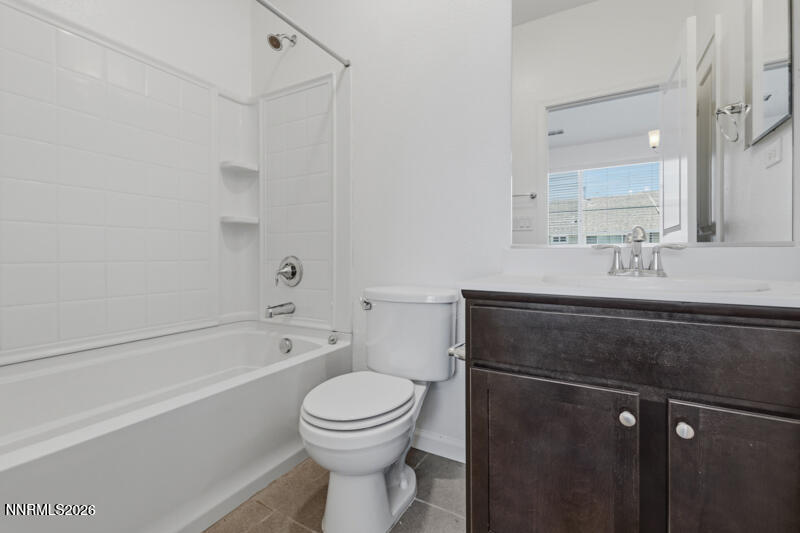 285 Mark Jeffrey Lane Reno, NV 89503 - Photo 12 of 20 a bathroom with a sink a toilet and a bathtub
