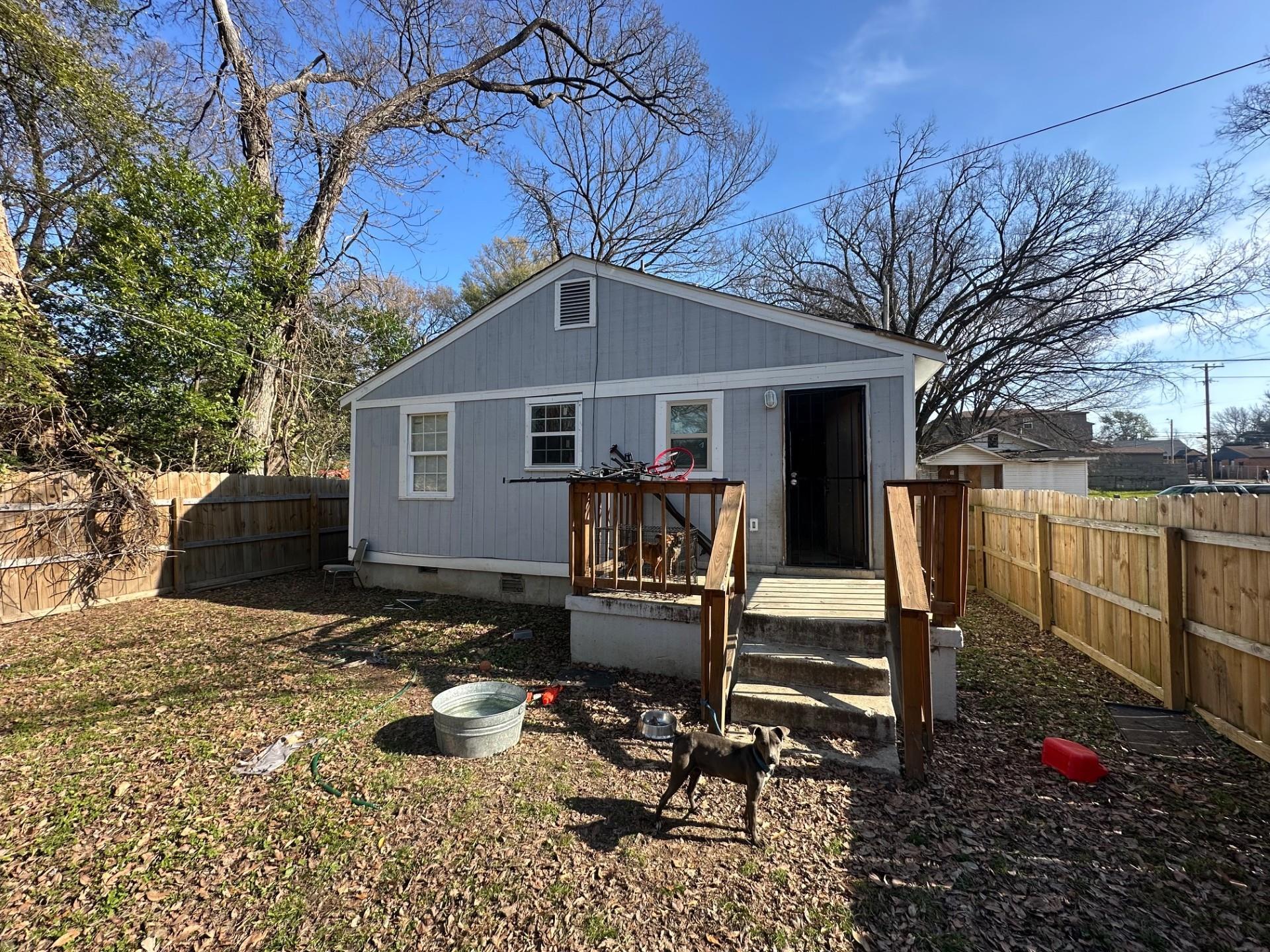 1435 Silver Street Memphis, TN 38106 - Photo 7 of 7 Rear view of property featuring crawl space, a fenced backyard, and a wooden deck