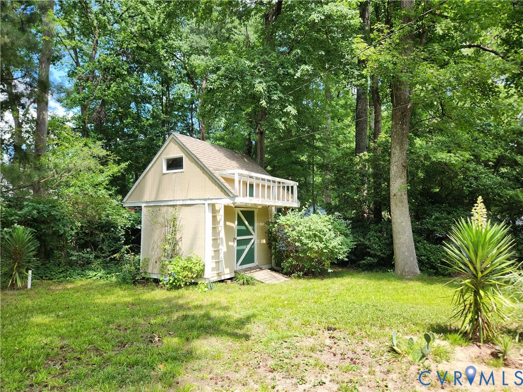 10260 Maplested Lane Henrico, VA 23229 - Photo 37 of 38 Detached shed with light yellow siding, a gambrel