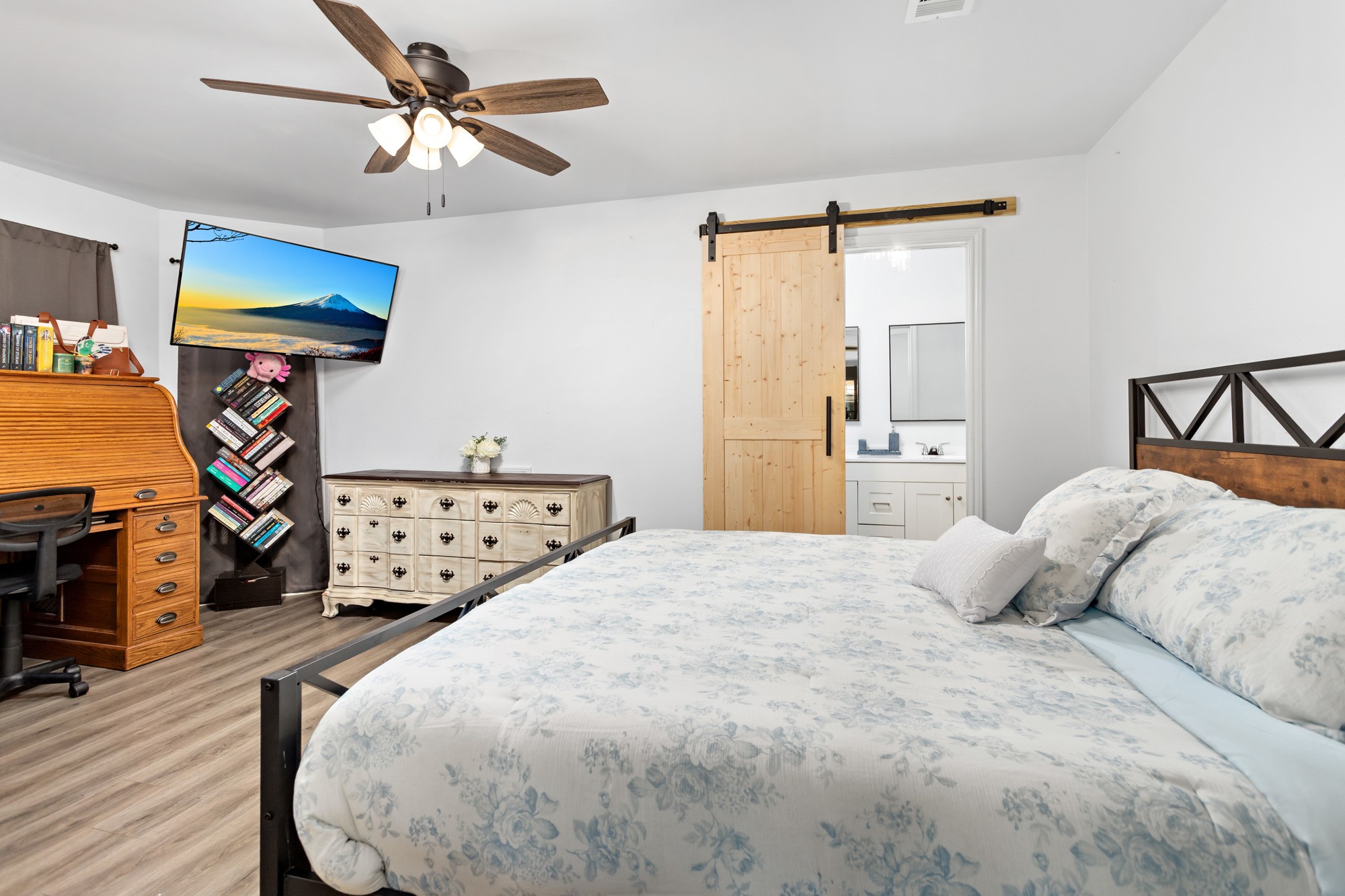 9994 Ruby Lane Silsbee, TX 77656 - Photo 10 of 17 a bedroom with a bed and wooden floor