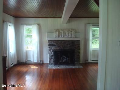 96 Fairview Road Monterey, MA 01245 - Photo 2 of 5 a view of an empty room with wooden floor and a window