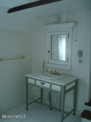 96 Fairview Road Monterey, MA 01245 - Photo 3 of 5 a room with a sink a vanity and mirror