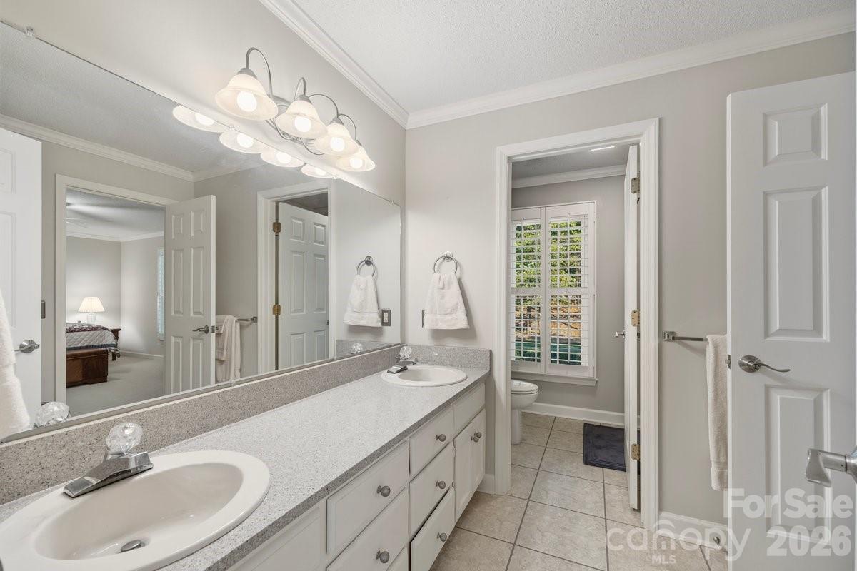 207 Lost Corner Road Morganton, NC 28655 - Photo 36 of 46 a bathroom with a sink double vanity and a mirror
