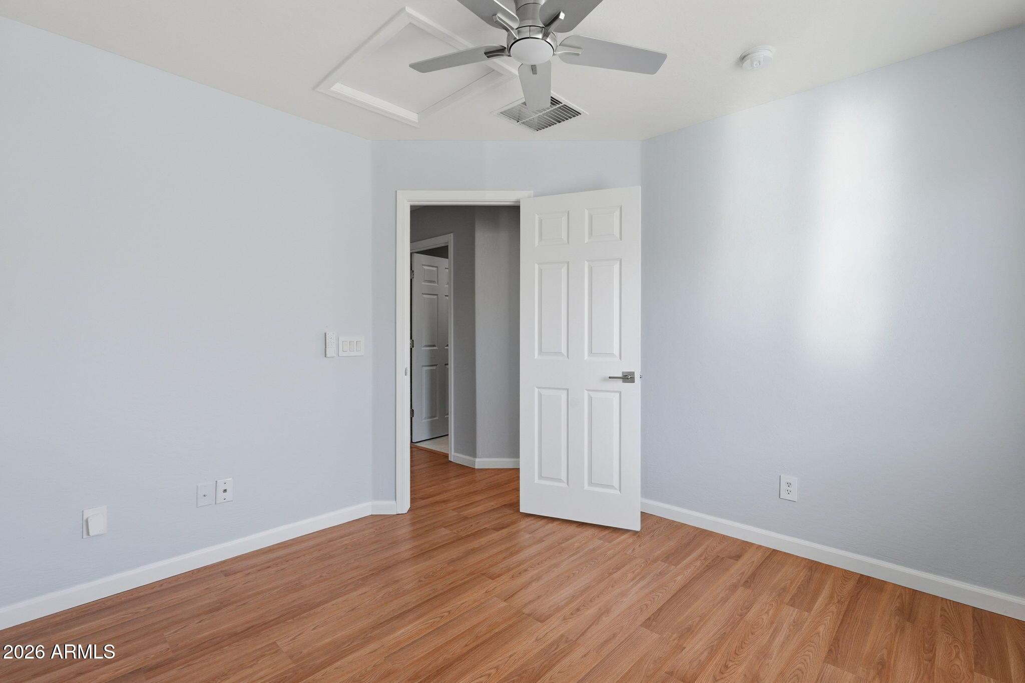 4678 East Redfield Road Gilbert, AZ 85234 - Photo 17 of 31 a view of an empty room with wooden floor