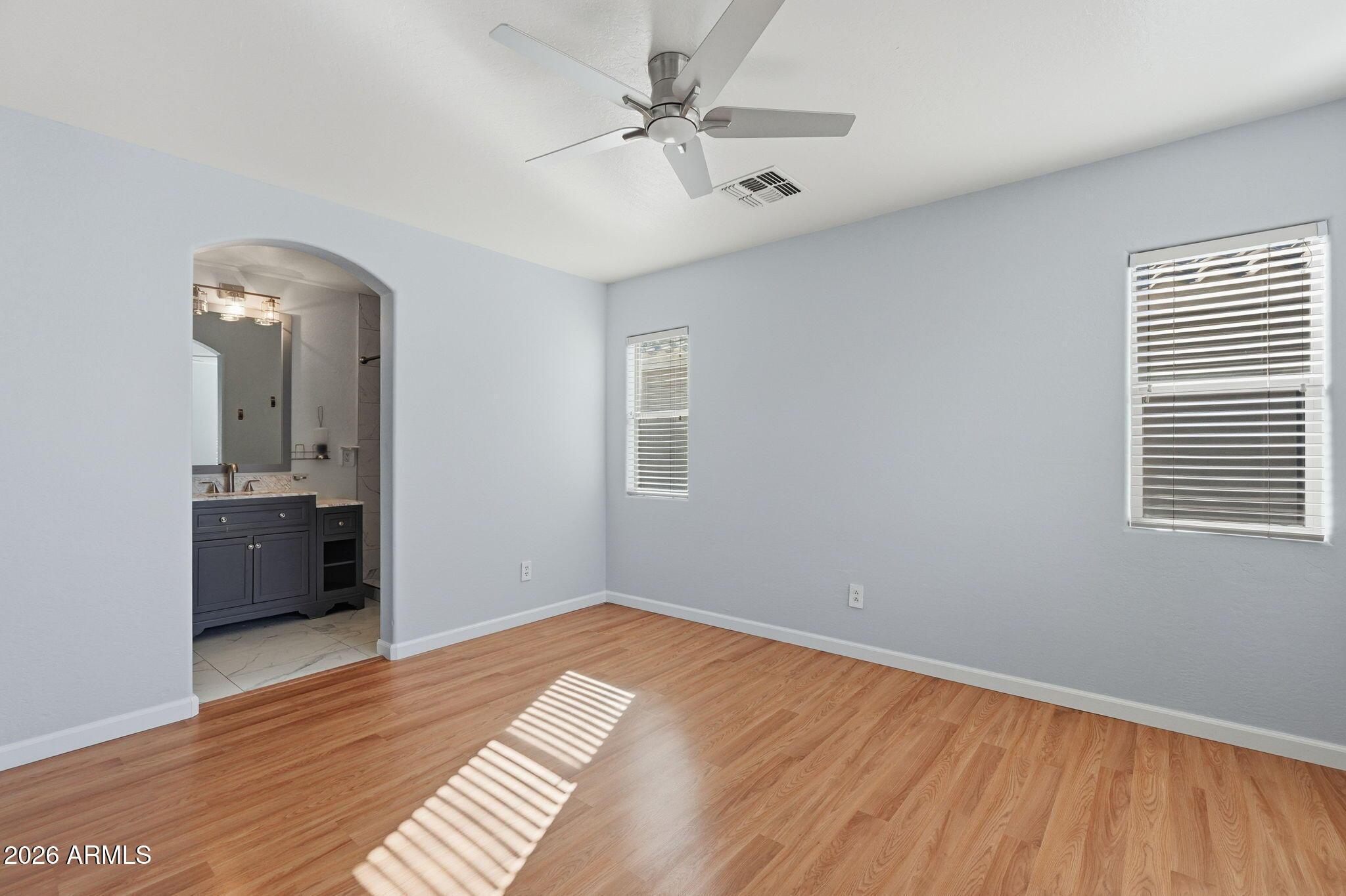 4678 East Redfield Road Gilbert, AZ 85234 - Photo 20 of 31 wooden floor in an empty room with a window