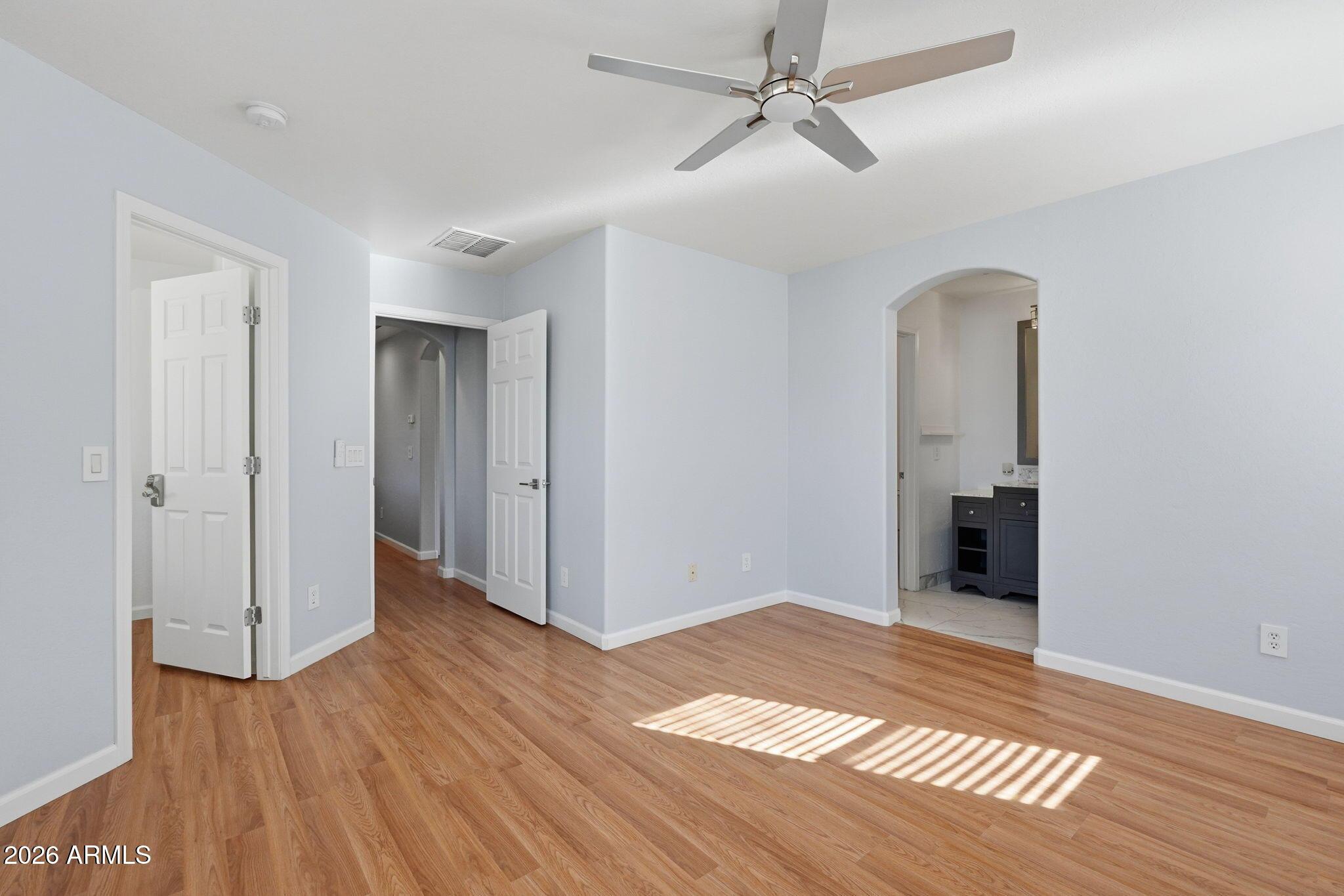 4678 East Redfield Road Gilbert, AZ 85234 - Photo 23 of 31 a view of an empty room with wooden floor
