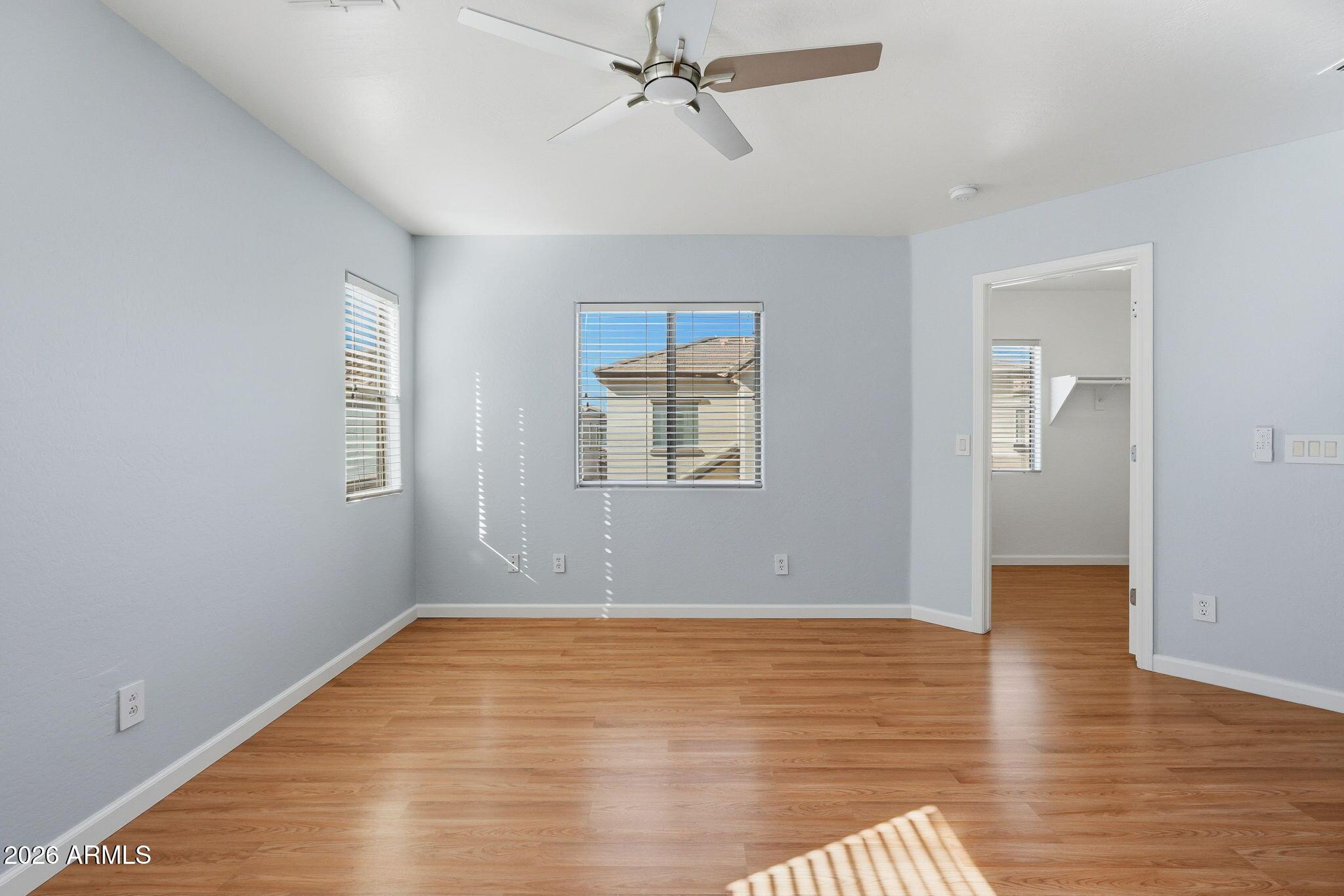 4678 East Redfield Road Gilbert, AZ 85234 - Photo 24 of 31 wooden floor in an empty room with a window