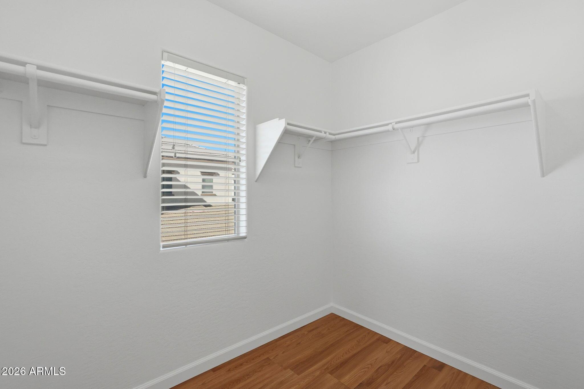 4678 East Redfield Road Gilbert, AZ 85234 - Photo 26 of 31 a view of a room with wooden floor and fan
