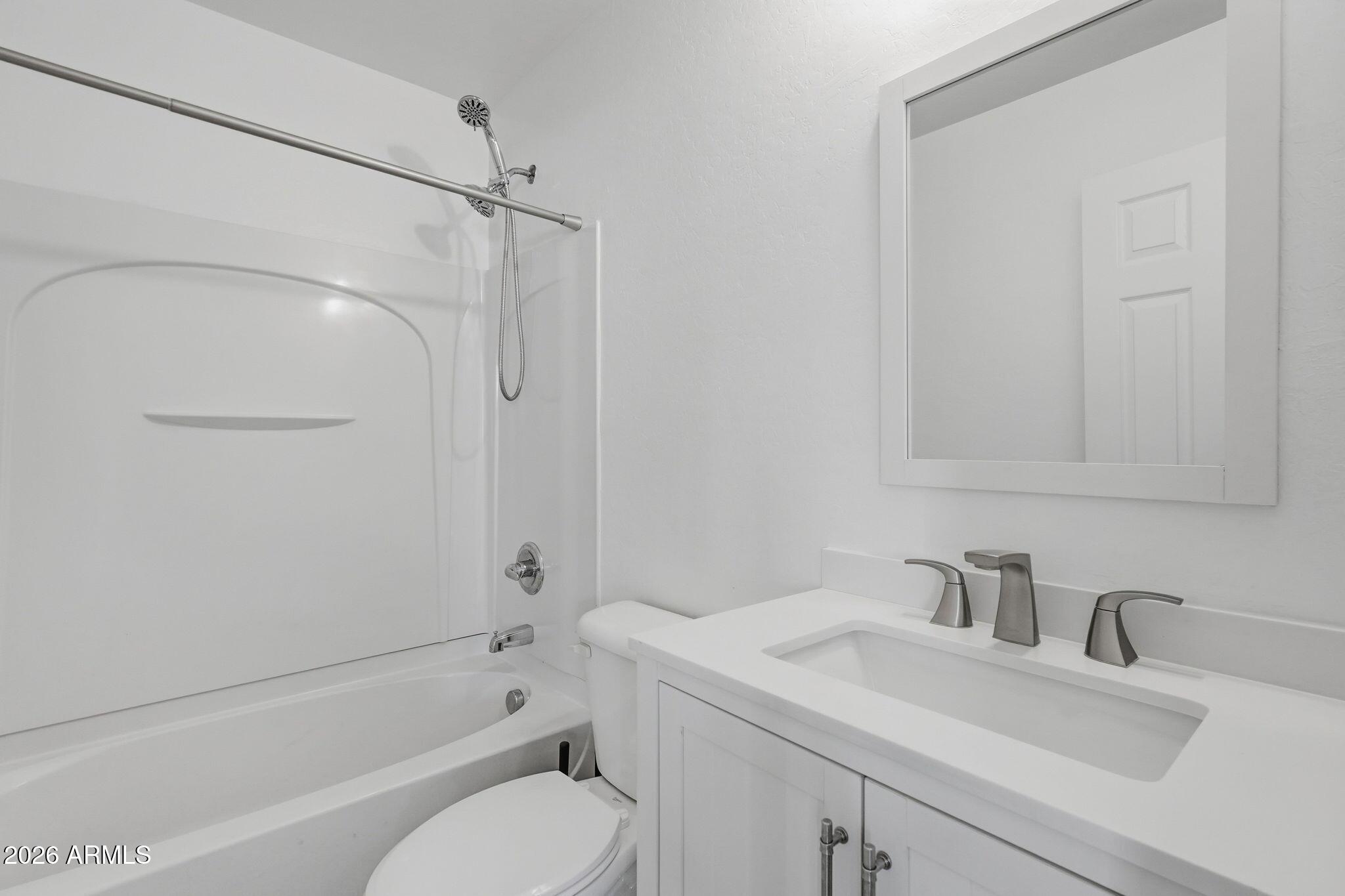 4678 East Redfield Road Gilbert, AZ 85234 - Photo 28 of 31 a bathroom with a sink toilet and shower