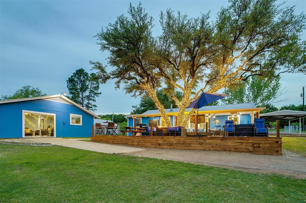520 Deer Trail Gordon, TX 76453 - Photo 38 of 40 View of jungle gym with a deck and a lawn