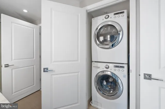 a view of a balcony with wooden floor and fence