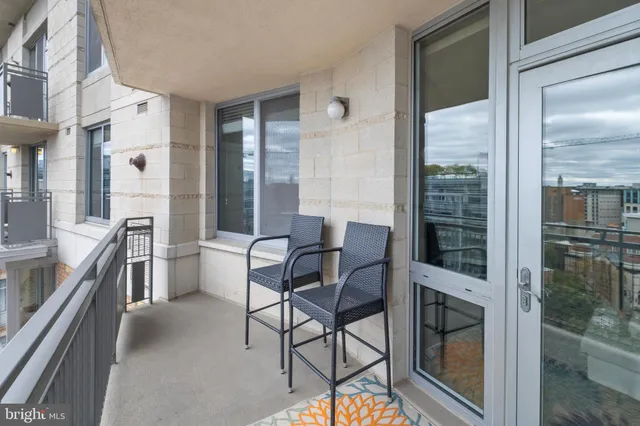 a view of balcony with furniture