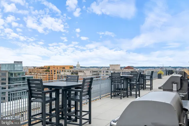 a view of a balcony with chairs