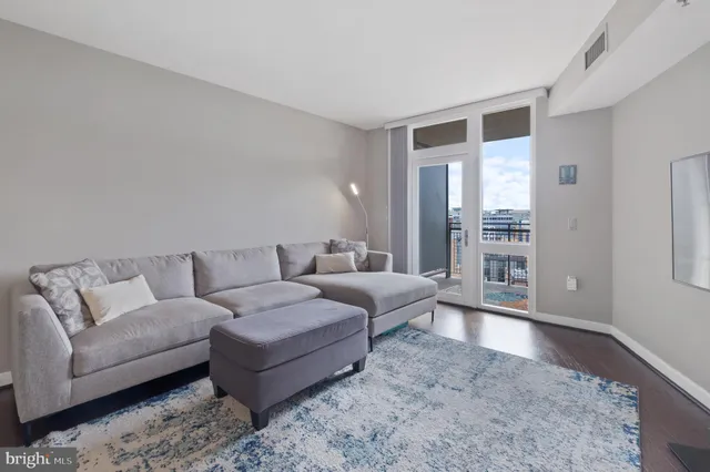 a bed room with a bed and a large window