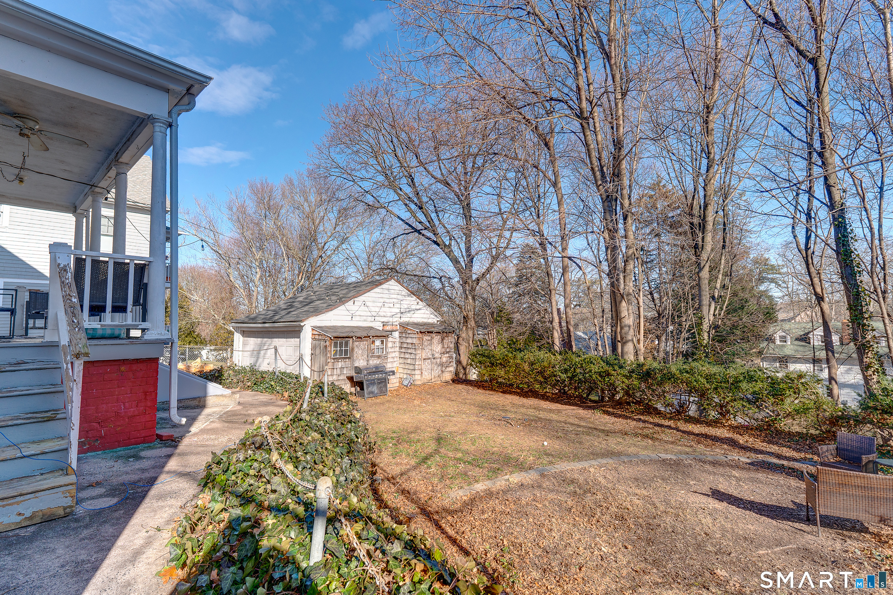 59 Morris Street Hamden, CT 06517 - Photo 12 of 15 a view of a house with a yard covered in snow