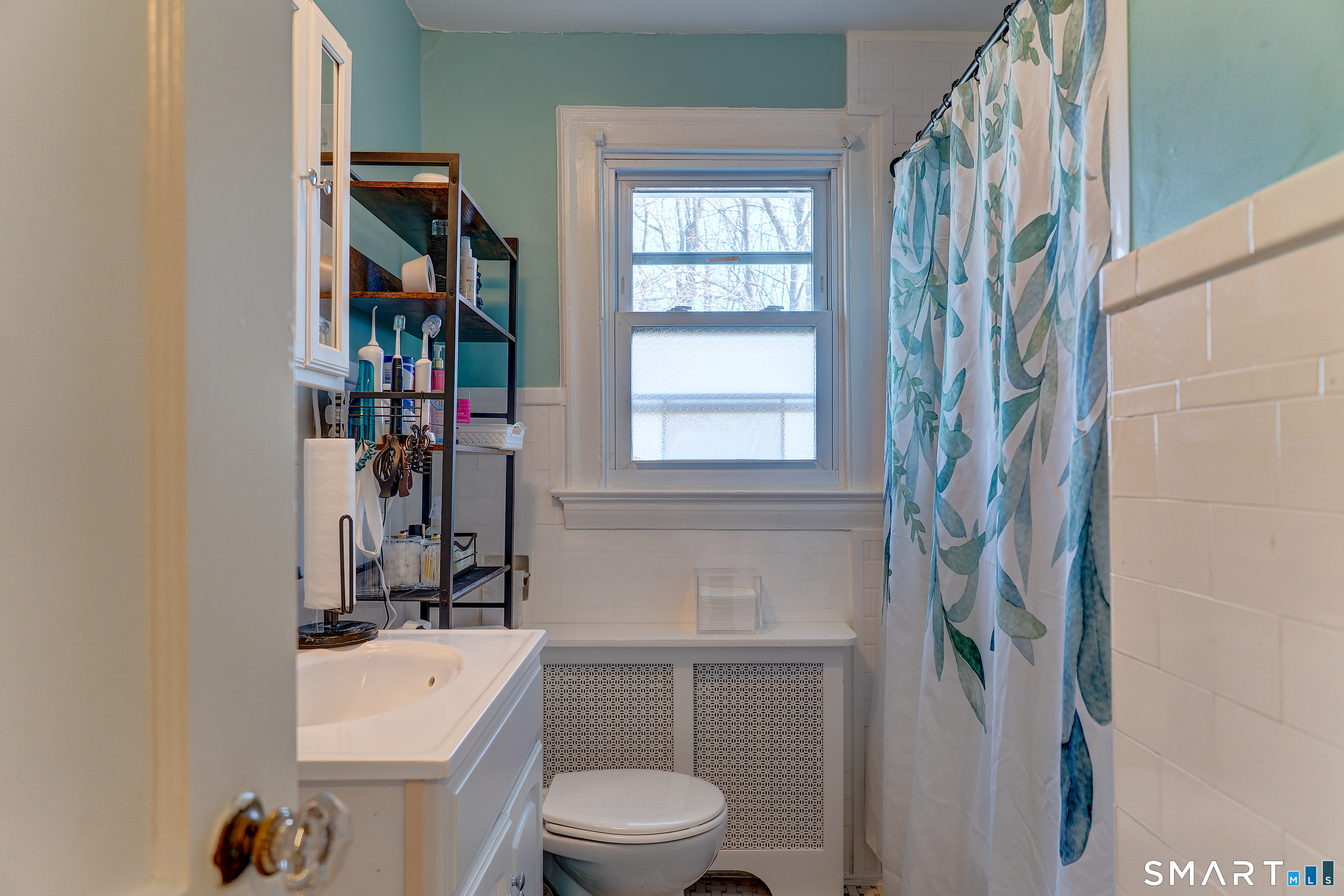 59 Morris Street Hamden, CT 06517 - Photo 6 of 15 a bathroom with a sink a toilet and a shower