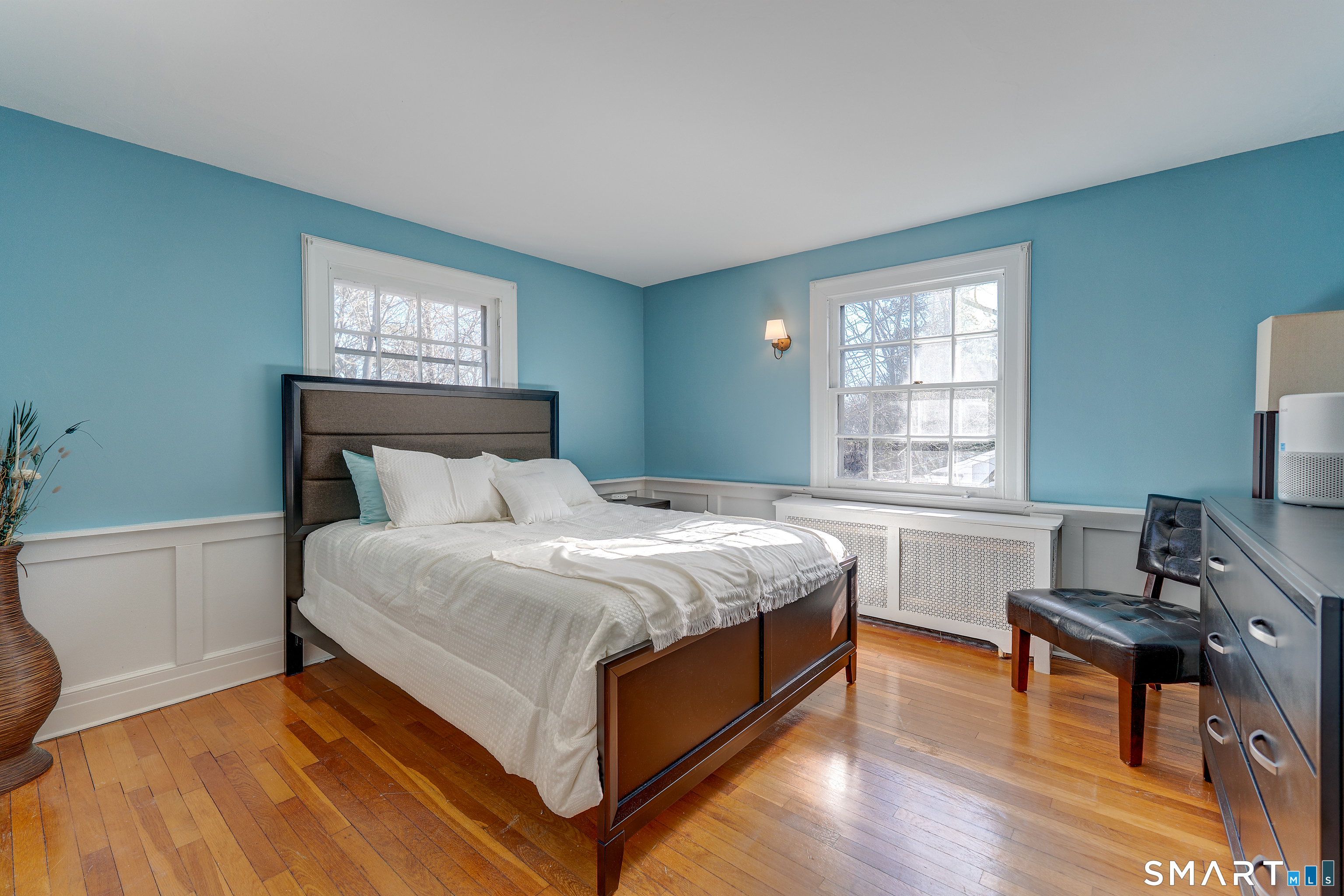 59 Morris Street Hamden, CT 06517 - Photo 7 of 15 a bed sitting in a bedroom next to a window