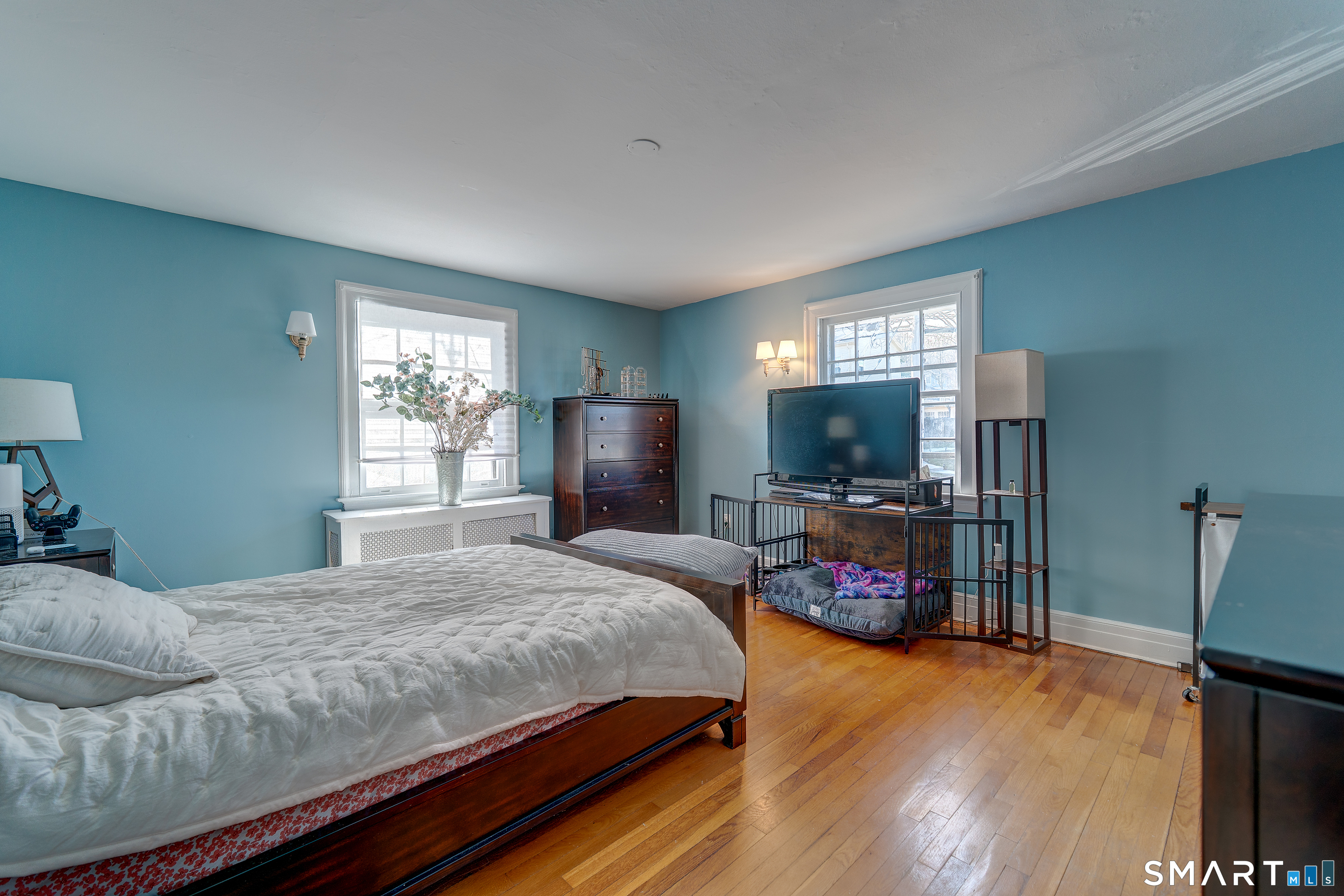 59 Morris Street Hamden, CT 06517 - Photo 8 of 15 a bedroom with a bed and a flat screen tv