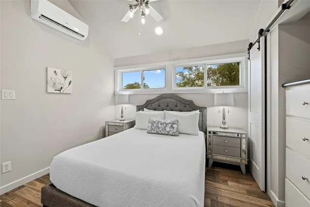 a bedroom with a bed and window