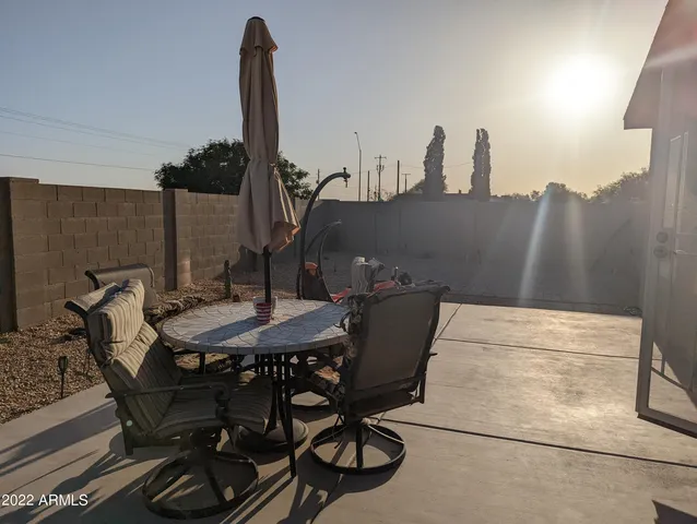 a view of a terrace with furniture and has wooden floor