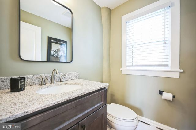 a kitchen with sink refrigerator and window