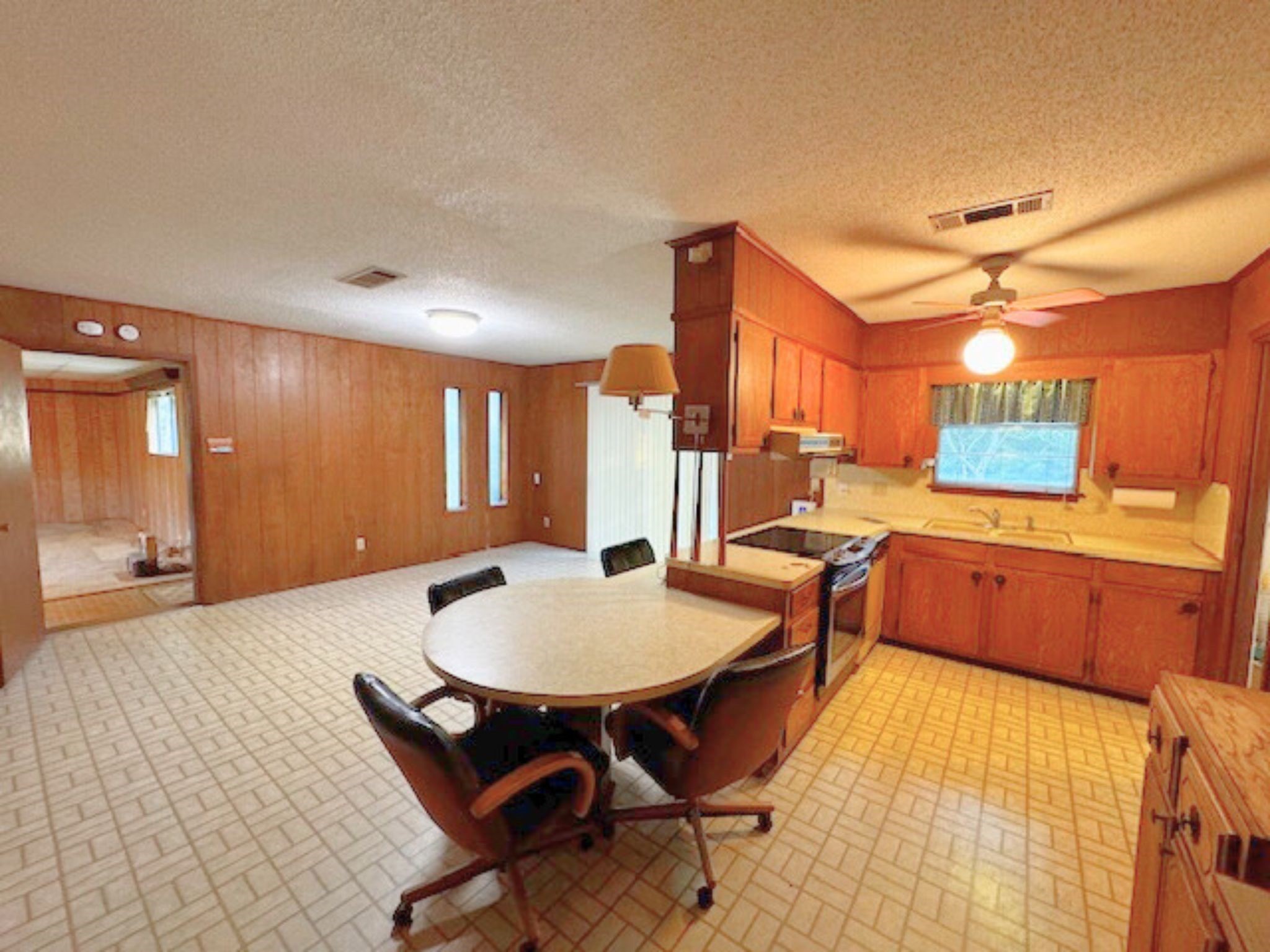 4345 Treadway Road Beaumont, TX 77708 - Photo 4 of 21 a large kitchen with a table and chairs