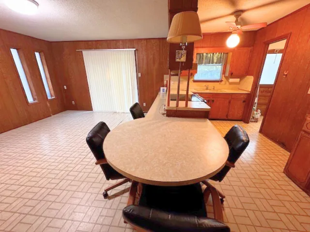 a balcony with table and chairs